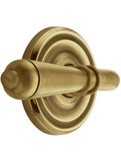 Classic Rosette Set With Turino Levers Left Hand in Antique Brass.